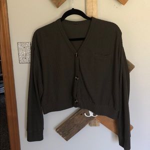 green sweater with buttons